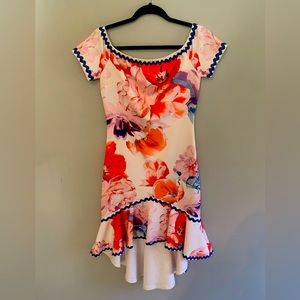 Above the knee high low dress. Thick, stretchy, non-see through material.